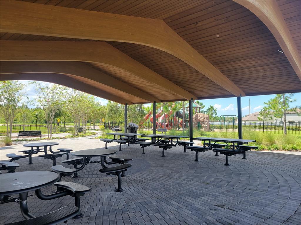 13443 White Sapphire Road Riverview, FL 33579 - Photo 46 of 47 a view of swimming pool with lawn chairs couches and pool with wooden floor and pool view