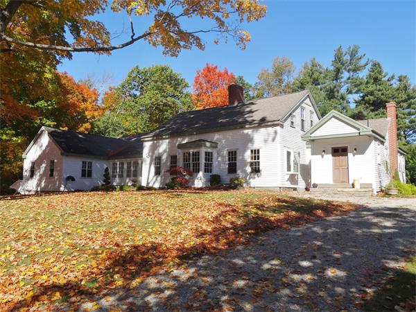 42 Smith Road Sutton, MA 01590 - Photo 1 of 30 a front view of a house with a big yard
