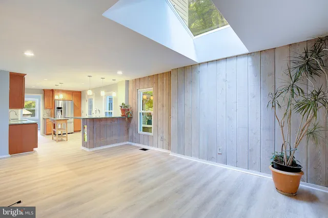 a view of livingroom with hardwood floor and a ceiling fan