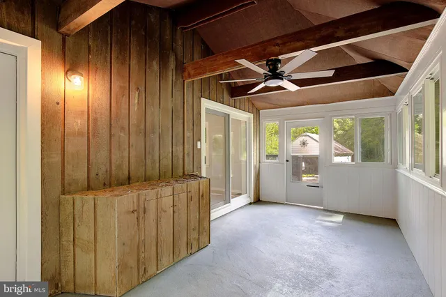 an empty room with closet area