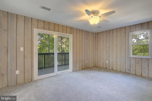 a view of deck with wooden floor and fence