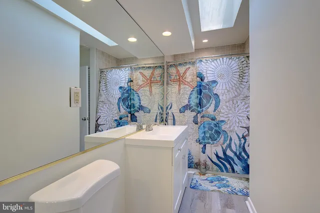 a view of deck and yard with green space