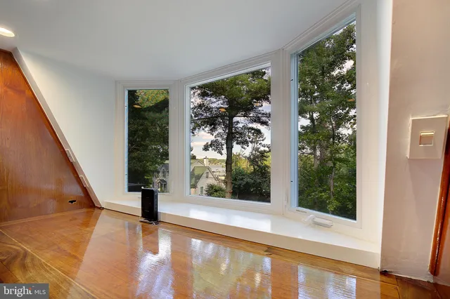 a room with a table and chairs