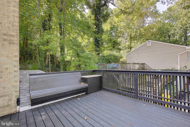 a view of a balcony with wooden floor