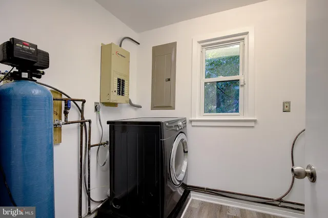 an aerial view of a houses with a yard