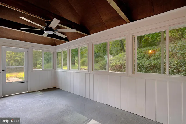 a front view of a house with a yard and a garage