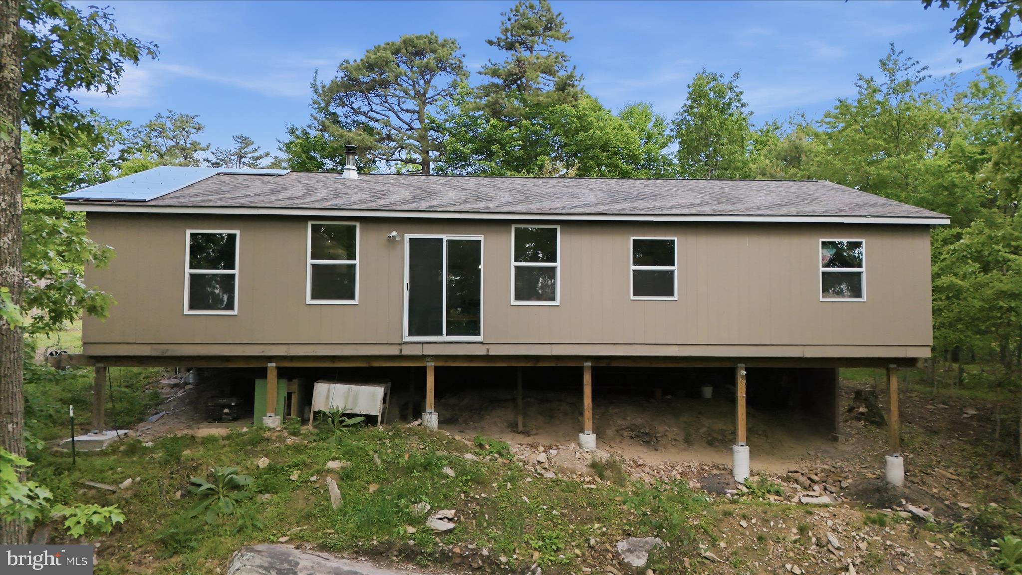 936 Johnny Cake Road Great Cacapon, WV 25422 - Photo 15 of 33 a backyard of a house