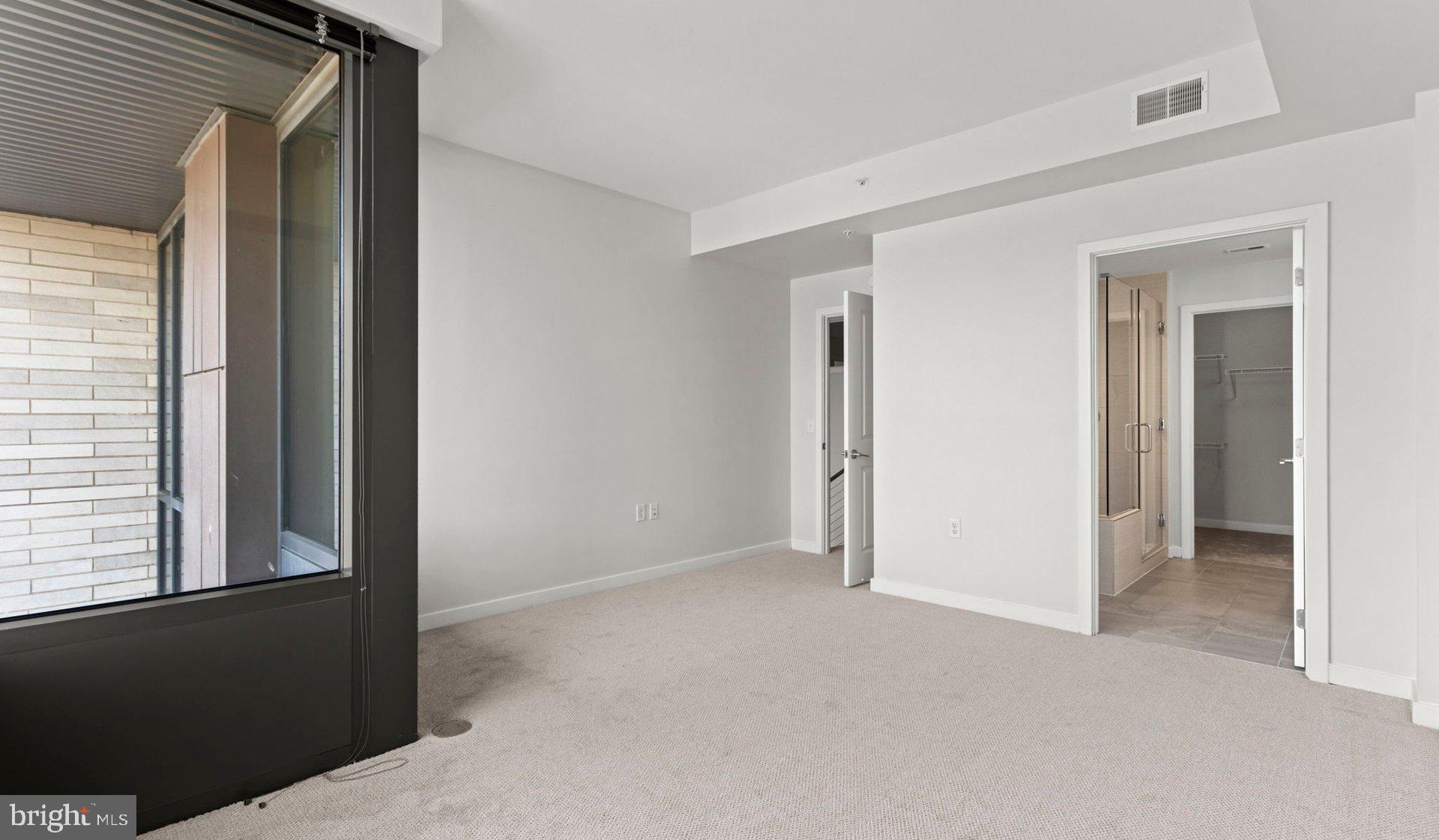 8300 Wisconsin Avenue, Unit 1B1809 Bethesda, MD 20814 - Photo 138 of 150 a view of an empty room and a window