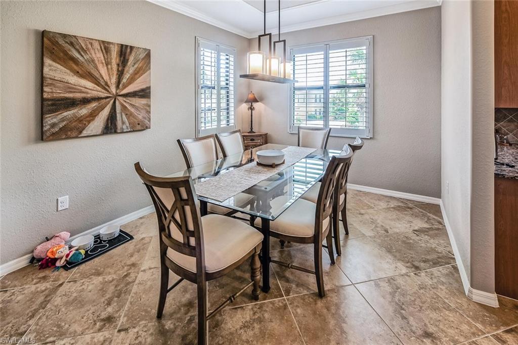 9107 Napoli Court, Unit 201 Naples, FL 34113 - Photo 12 of 35 a dining room with furniture and window