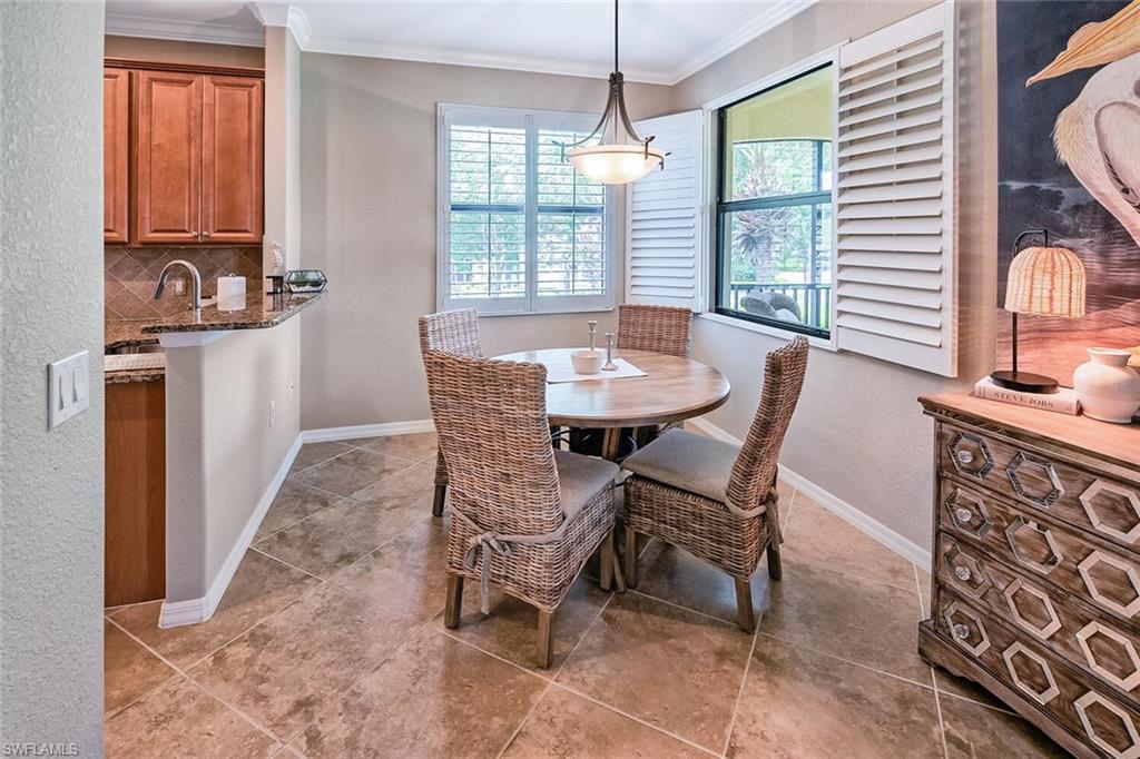 9107 Napoli Court, Unit 201 Naples, FL 34113 - Photo 9 of 35 a dining room with furniture and window