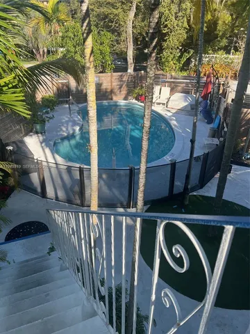 a view of street from balcony