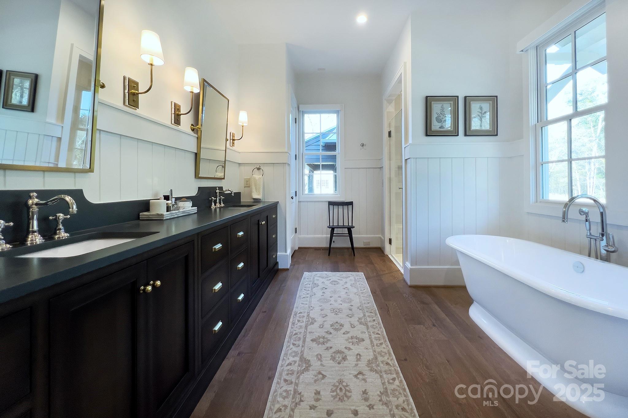 2270 New Gray Rock Road Fort Mill, SC 29708 - Photo 16 of 39 a spacious bathroom with a double vanity sink a mirror and a bathtub