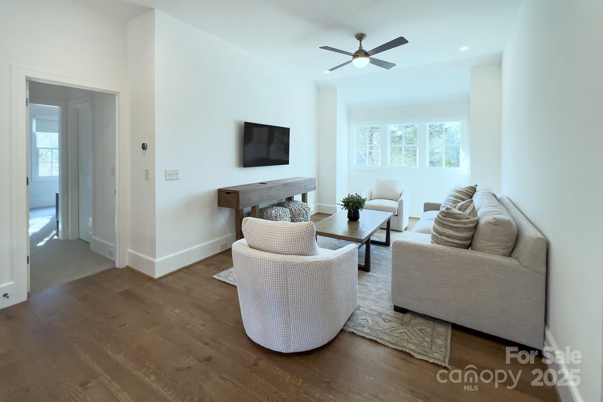 2270 New Gray Rock Road Fort Mill, SC 29708 - Photo 25 of 39 a living room with furniture and a flat screen tv