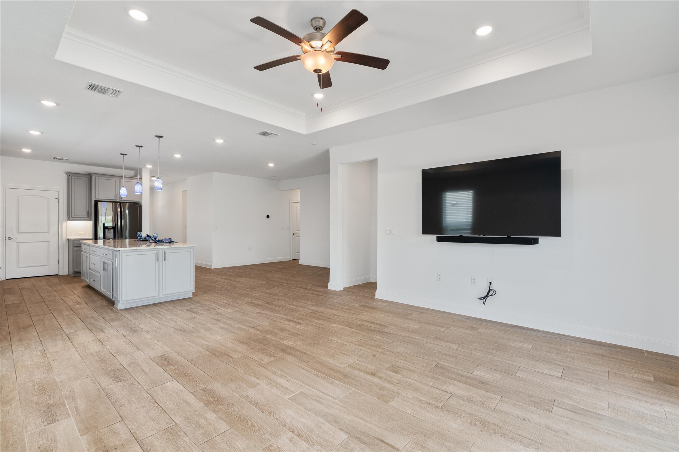 202 Spanish Star Street Georgetown, TX 78633 - Photo 16 of 32 a view of an empty room with a flat screen tv