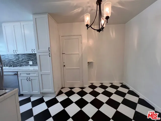 a black and white checkered floor with a black white checkered floor