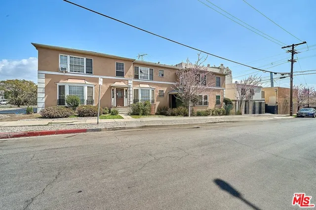 a view of a street with a building in the background