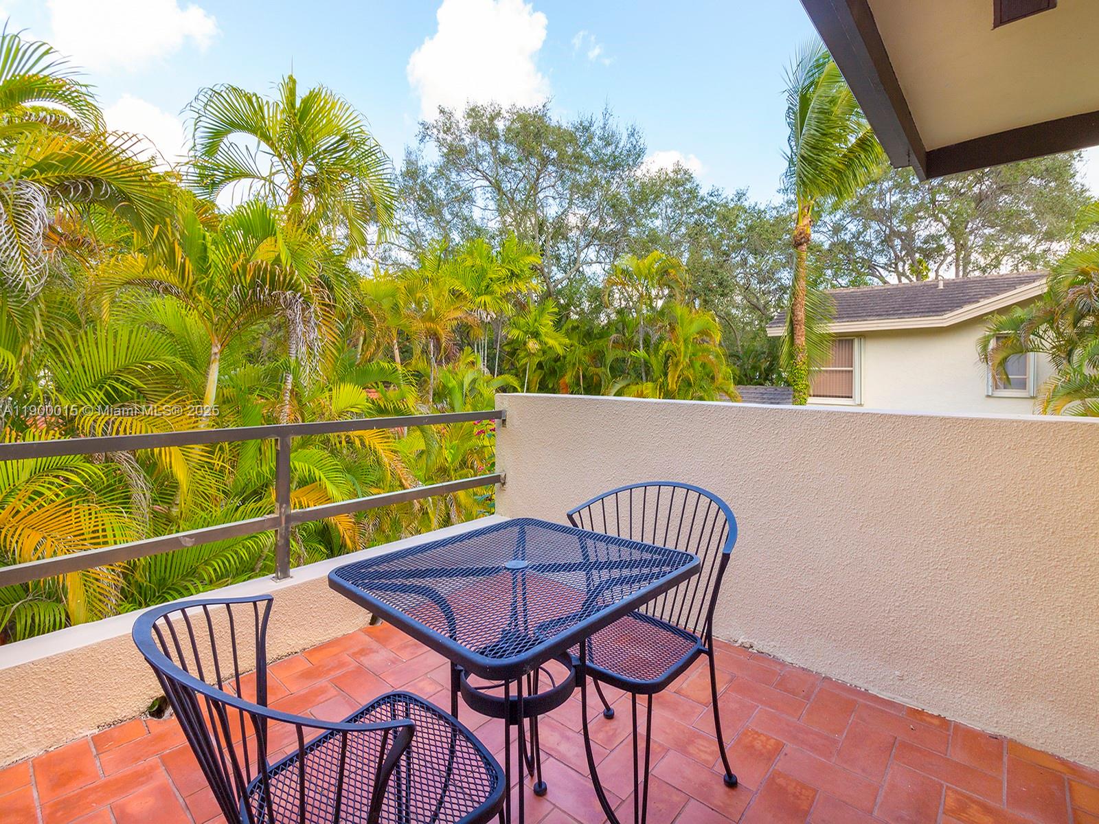 7950 Old Cutler Road Coral Gables, FL 33143 - Photo 20 of 30 a view of a chairs and table on the deck