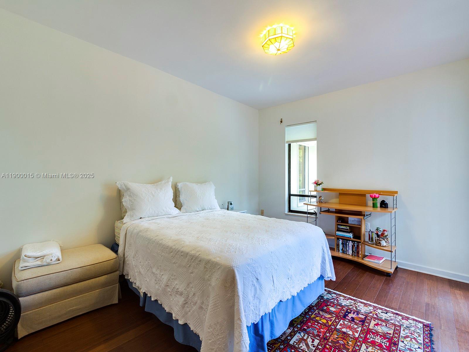 7950 Old Cutler Road Coral Gables, FL 33143 - Photo 22 of 30 a bedroom with a bed and a couch