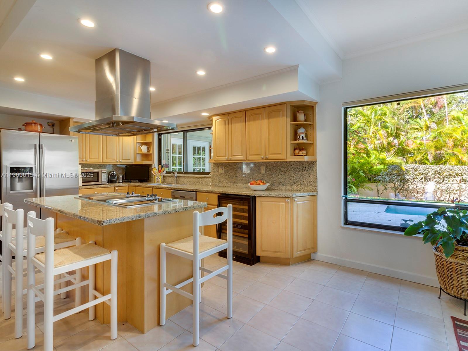 7950 Old Cutler Road Coral Gables, FL 33143 - Photo 9 of 30 a kitchen with stainless steel appliances granite countertop a stove a sink and a refrigerator