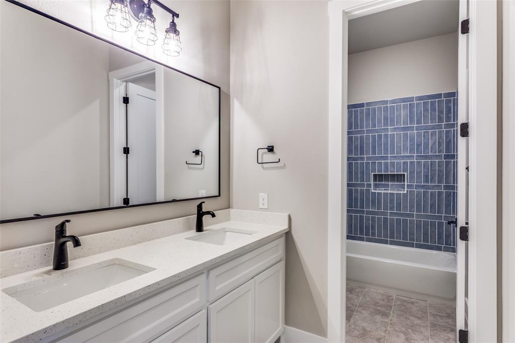 555 Aermotor Loop Weatherford, TX 76085 - Photo 22 of 30 a bathroom with a sink and a mirror