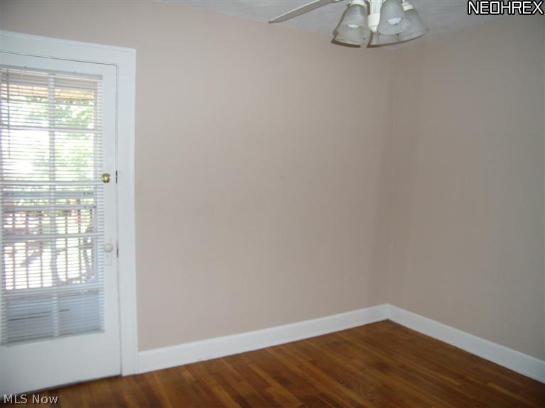 16711 Kenyon Road, Unit DOWN Cleveland, OH 44120 - Photo 9 of 11 A bedroom with access to the first floor porch.