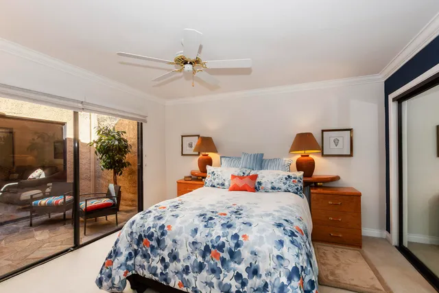 a bed room with a bed and a mirror