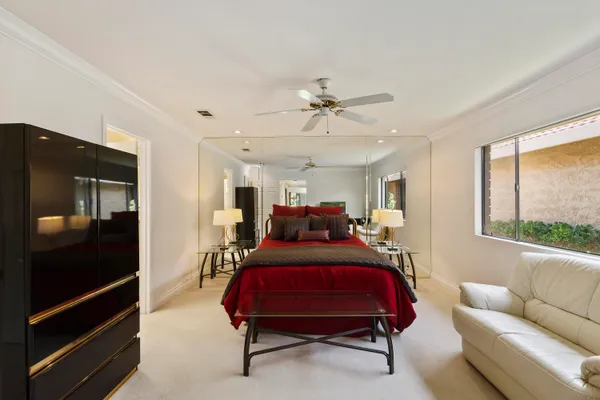 a bed room with furniture and a window