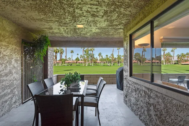 a dining area with furniture and outdoor view