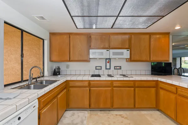a kitchen with a sink and cabinets