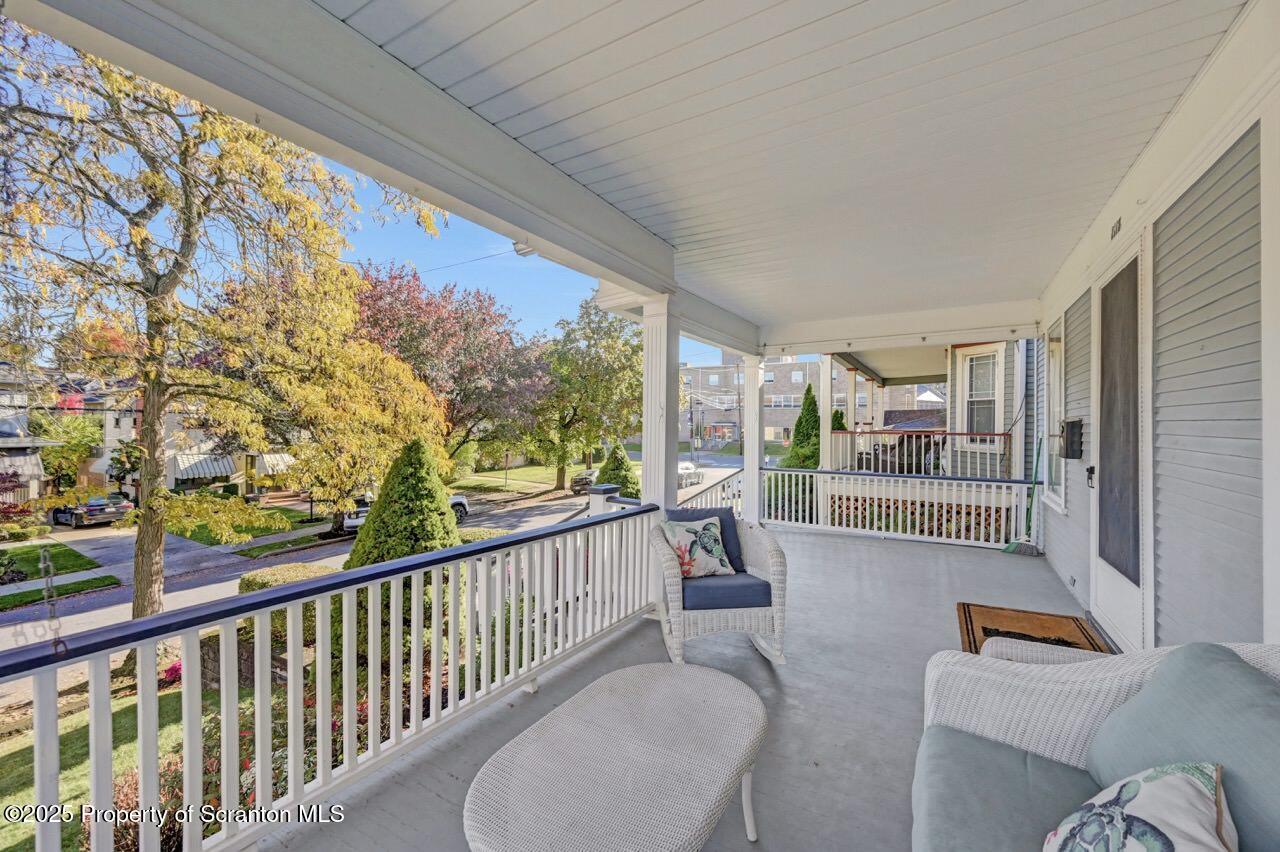 1118 Columbia Street Scranton, PA 18509 - Photo 12 of 92 a balcony with furniture and a floor to ceiling window