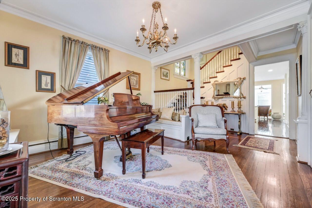1118 Columbia Street Scranton, PA 18509 - Photo 13 of 92 a work room with furniture a piano and wooden floor