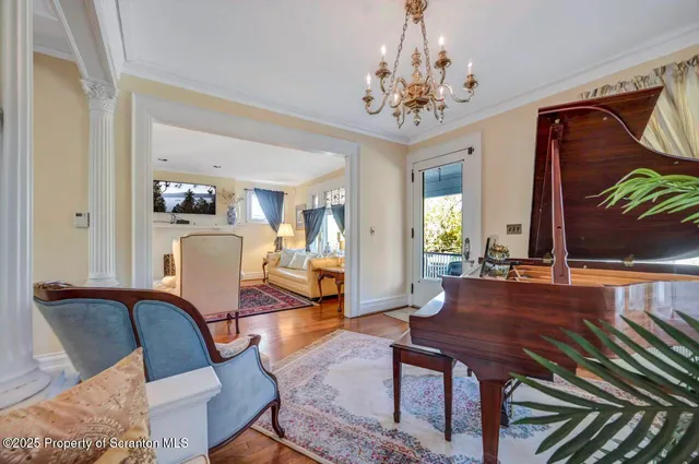 a view of a dining room with furniture and wooden floor