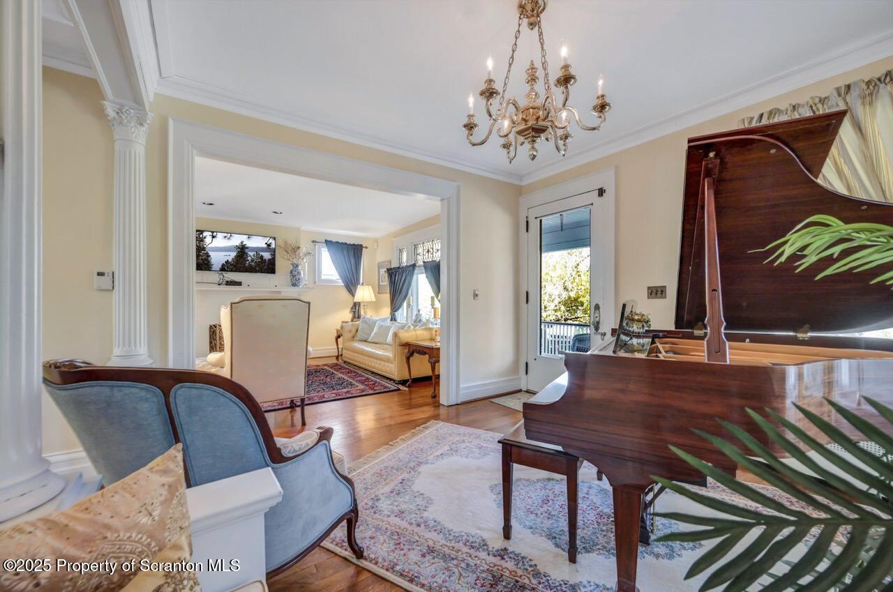 1118 Columbia Street Scranton, PA 18509 - Photo 16 of 92 a living room with furniture a dining table and a chandelier