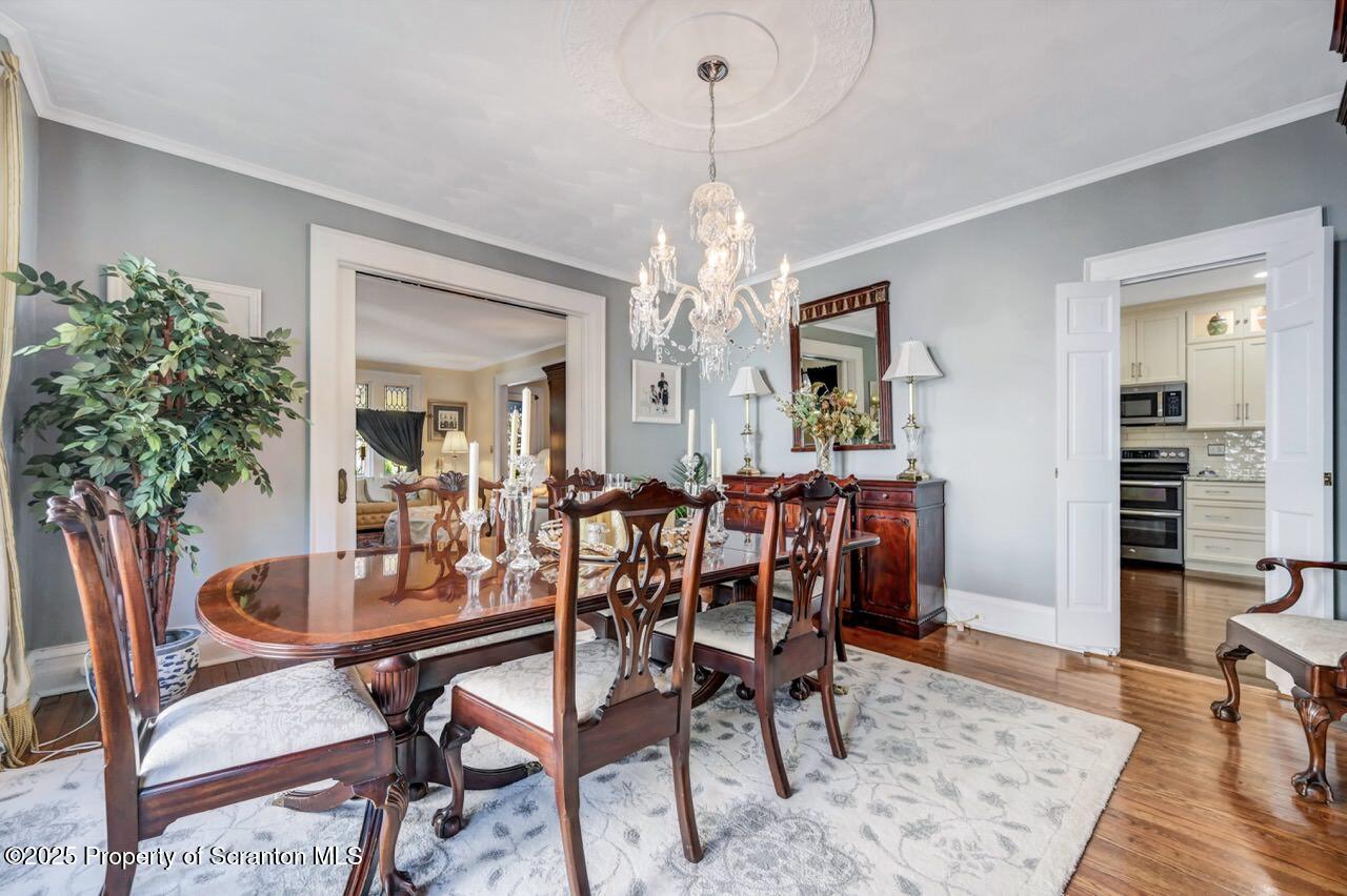 1118 Columbia Street Scranton, PA 18509 - Photo 27 of 92 a view of a dining room with furniture and wooden floor