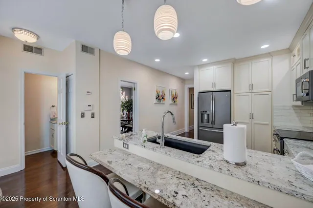a bedroom with a bed dresser and a window