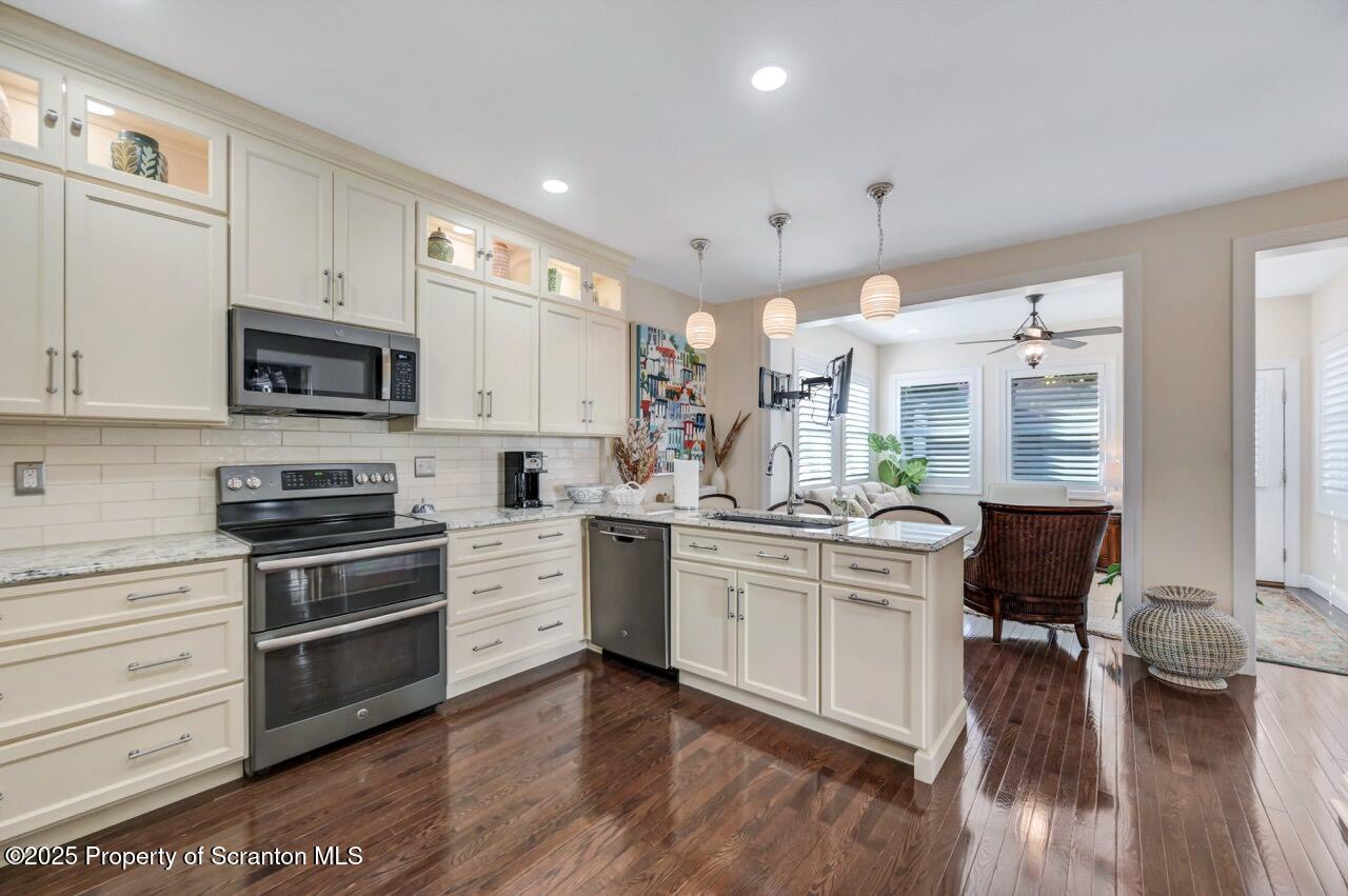 1118 Columbia Street Scranton, PA 18509 - Photo 32 of 92 a kitchen with stainless steel appliances granite countertop a stove and cabinets