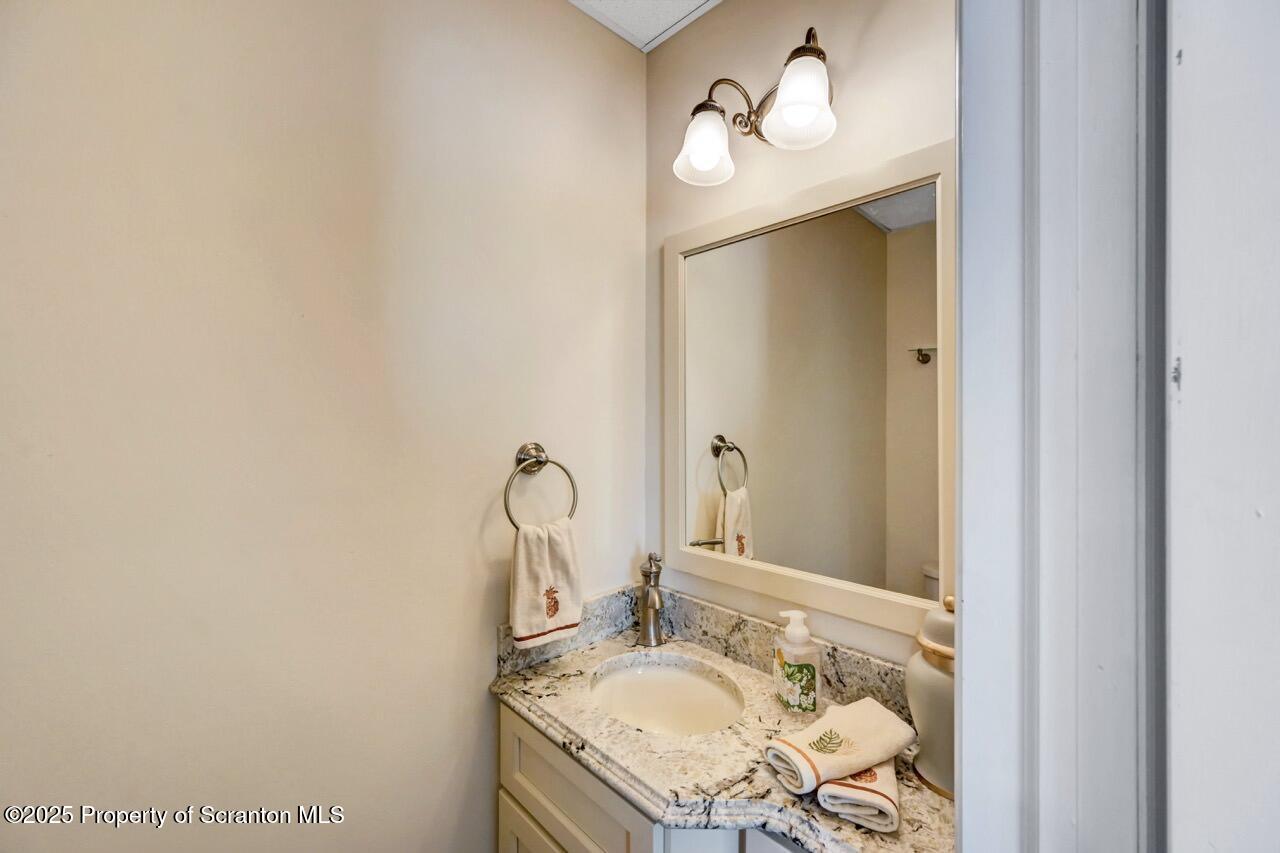 1118 Columbia Street Scranton, PA 18509 - Photo 36 of 92 a bathroom with a sink and a mirror