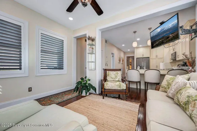 a bedroom with furniture and a book shelf