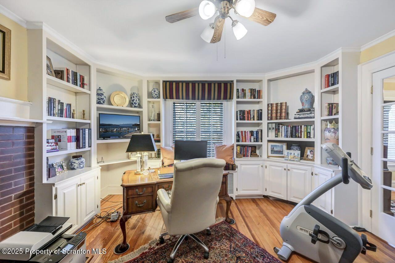 1118 Columbia Street Scranton, PA 18509 - Photo 51 of 92 a view of a workspace with furniture and a bookshelf