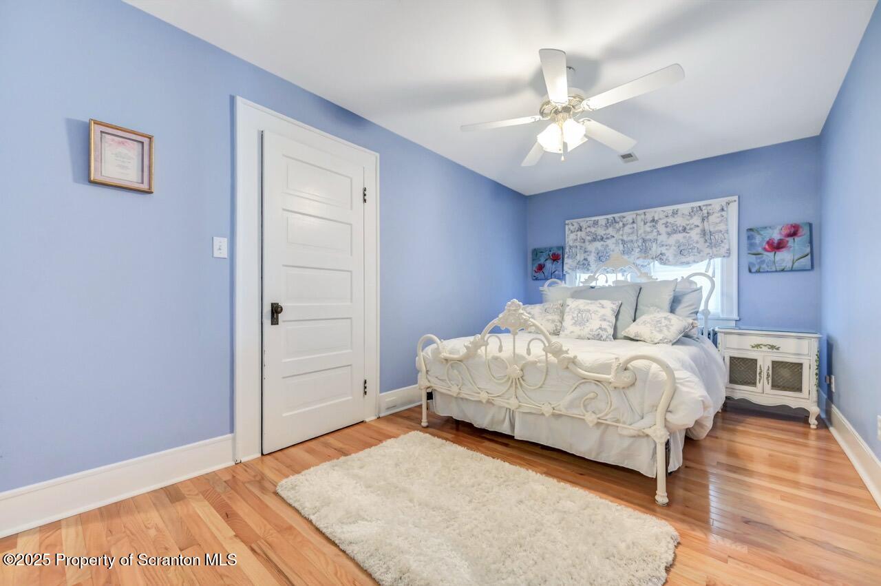 1118 Columbia Street Scranton, PA 18509 - Photo 73 of 92 a bed room with a bed and a chandelier