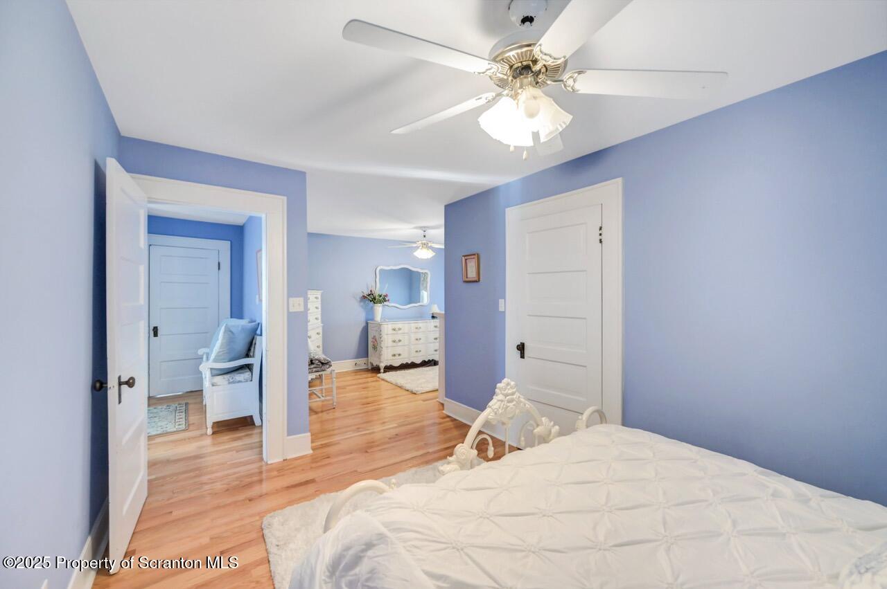 1118 Columbia Street Scranton, PA 18509 - Photo 74 of 92 a bedroom with a bed and a chandelier