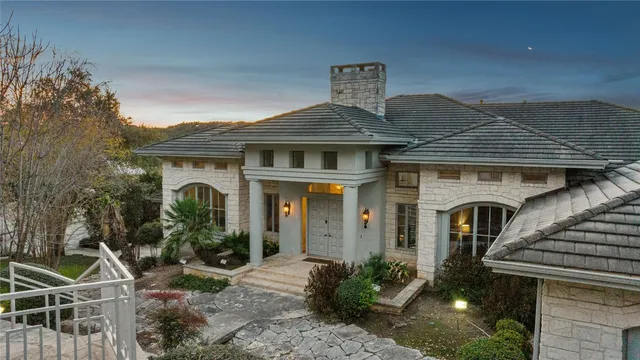 a front view of a house with garden