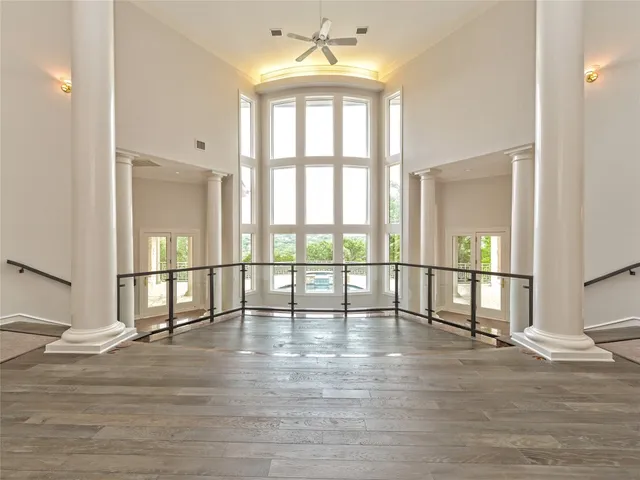 a view of an entryway with wooden floor