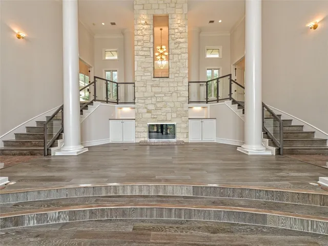 a view of front door and hallway with wooden floor