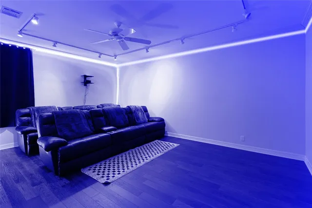 a living room with couch and wooden floor