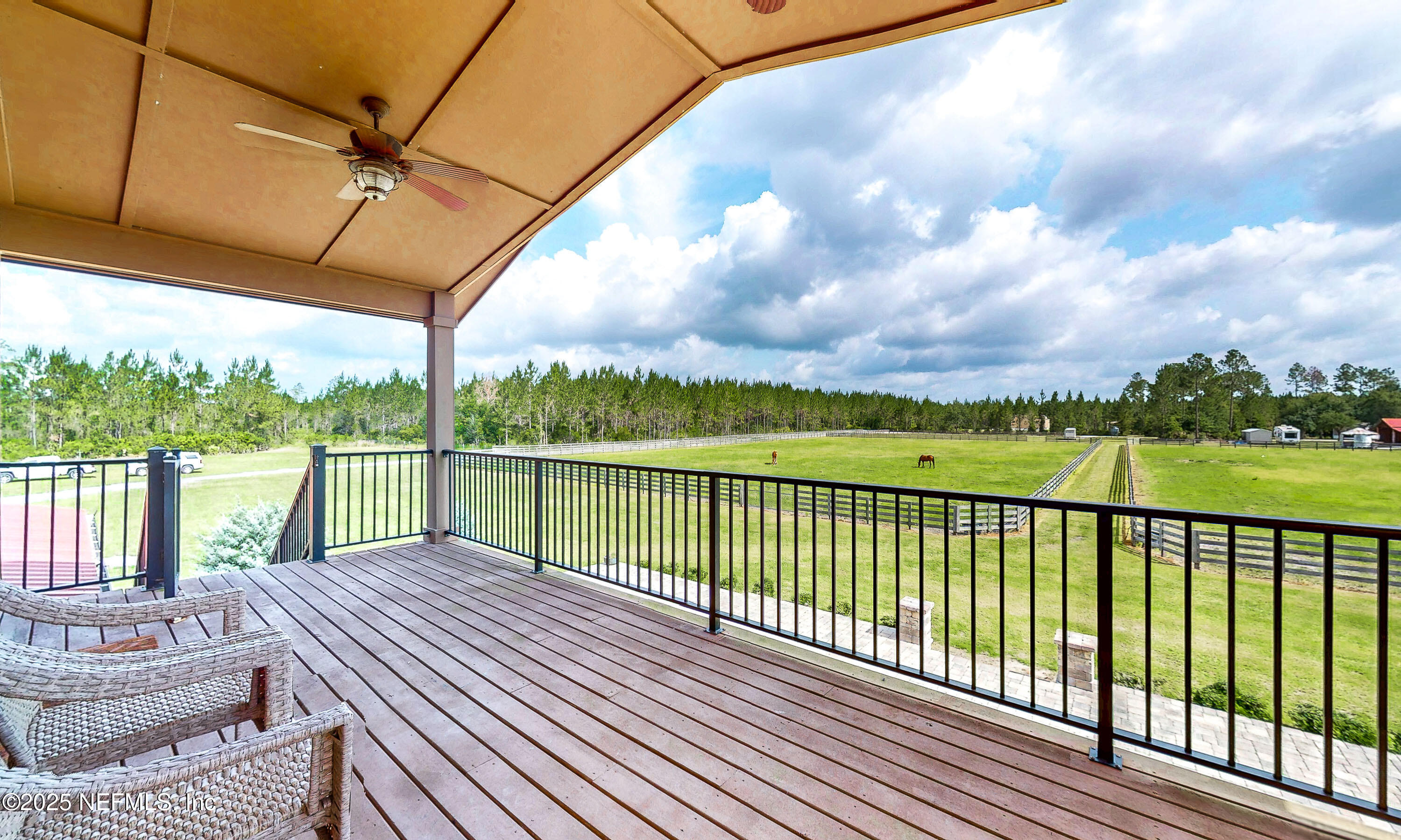1845 Kinard Road Bryceville, FL 32009 - Photo 12 of 86 a view of a balcony with lake view and a floor to ceiling window