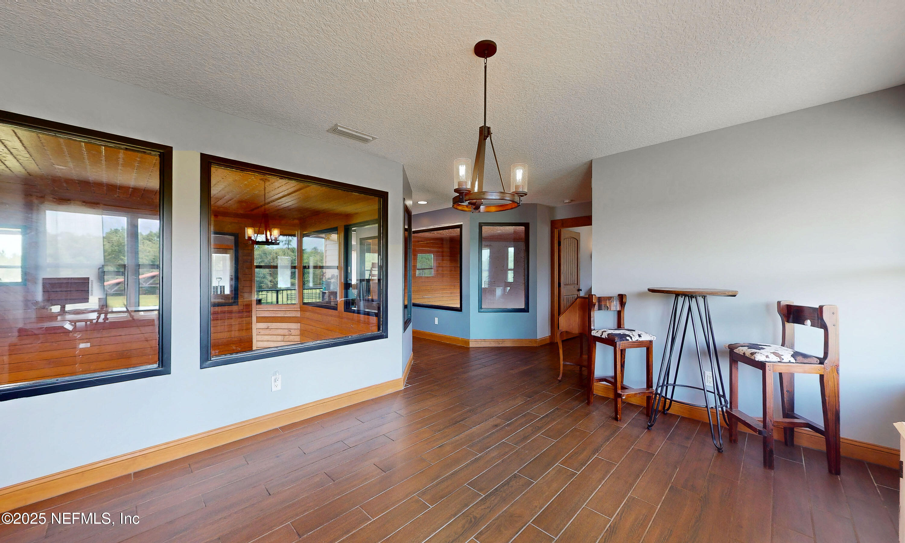 1845 Kinard Road Bryceville, FL 32009 - Photo 20 of 86 a view of an empty room with wooden floor and a window