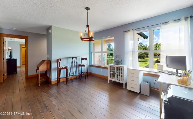 a view of balcony with wooden floor