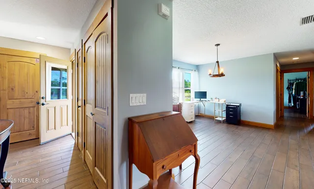 a bedroom with a bed a dresser and a window