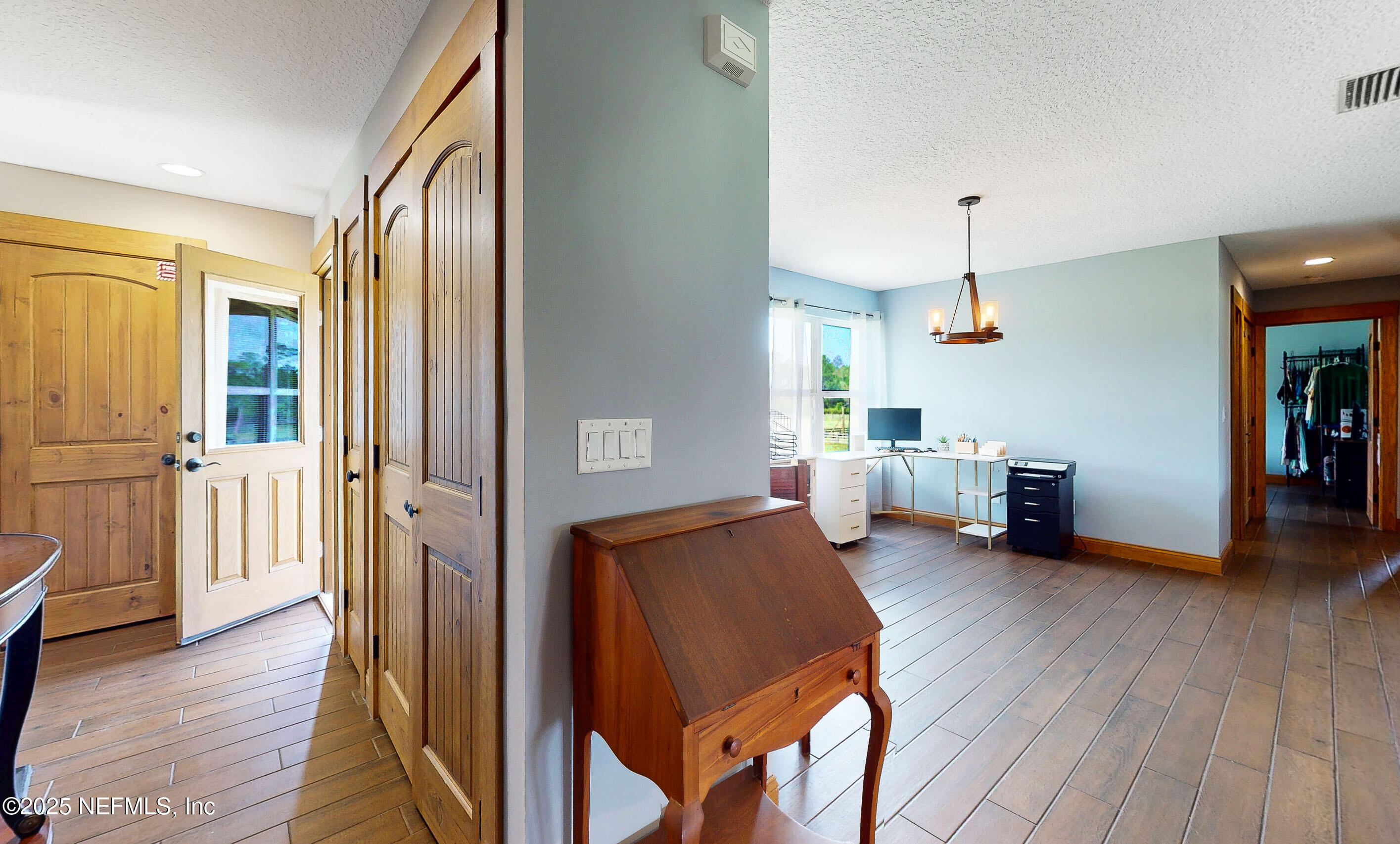 1845 Kinard Road Bryceville, FL 32009 - Photo 27 of 86 a living room with furniture and a wooden floor